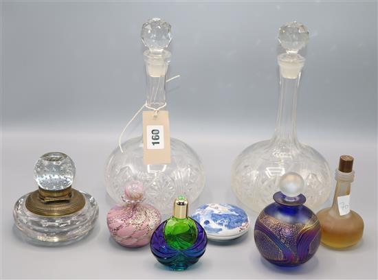 A glass inkwell, scent bottles and two decanters